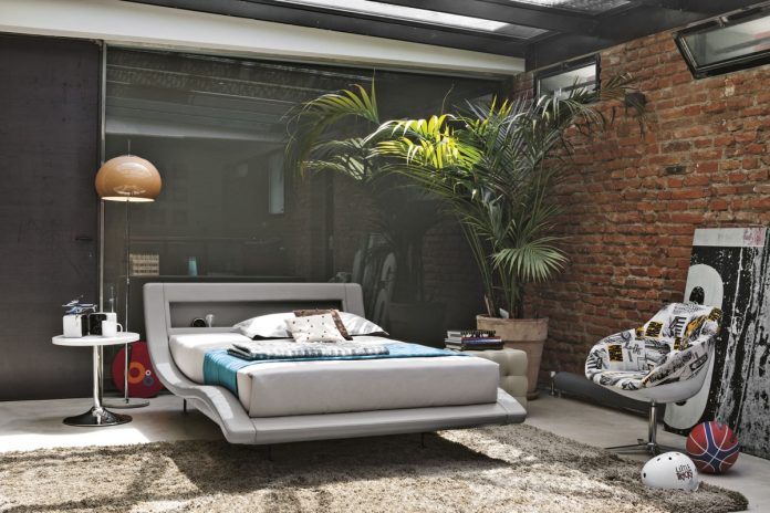 lush jungle bedroom with exposed brick