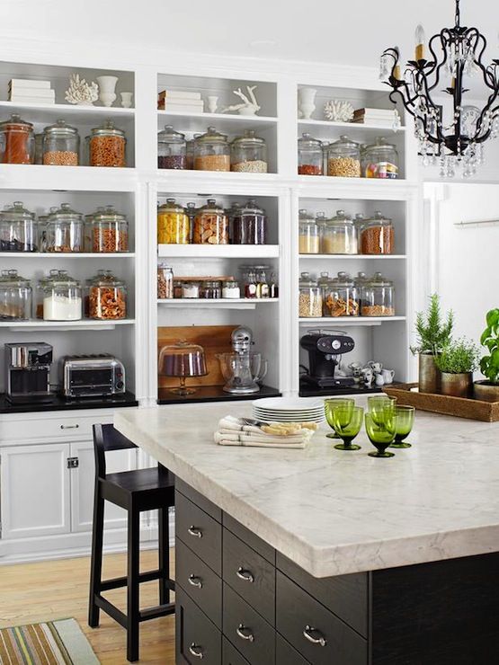Fantastic wall of built-in open shelving for pantry staples and .