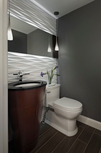 Powder room with a gorgeous accent wall. An excellent installation .