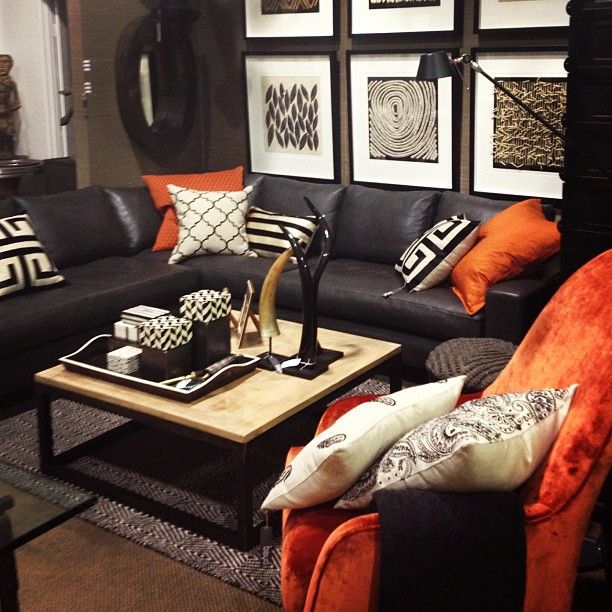 Masculine room setting with bold orange colour blocking at Boyd .