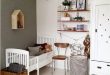 Love the dark wooden touches - a vintage and modern toddler room .