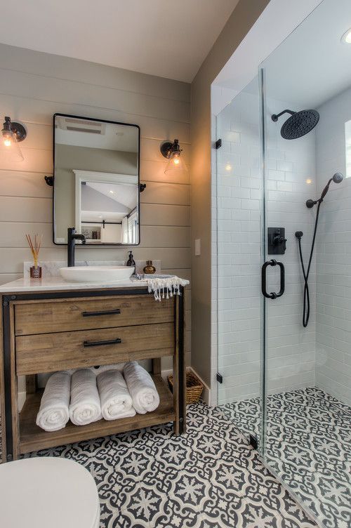 Love this farmhous bathroom! Wood vanity, patterned floor, black .
