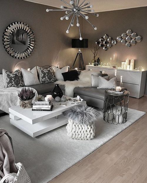 Contemporary Living Room with excellent use of light and mirrors .