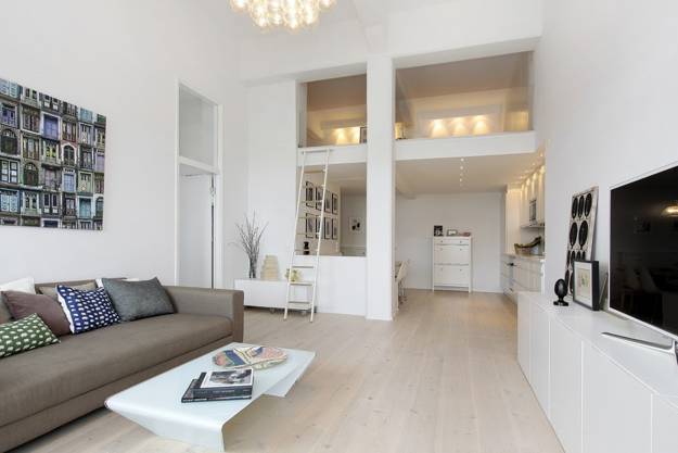 Spacious Interior Design Emphasizing Elegant Loft Living Style .