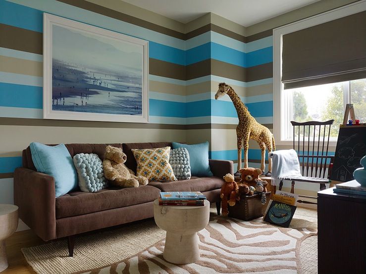 Fantastic boy's playroom with beige, blue & brown stripe walls .