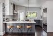 White and gray kitchen features gray distressed cabinets paired .