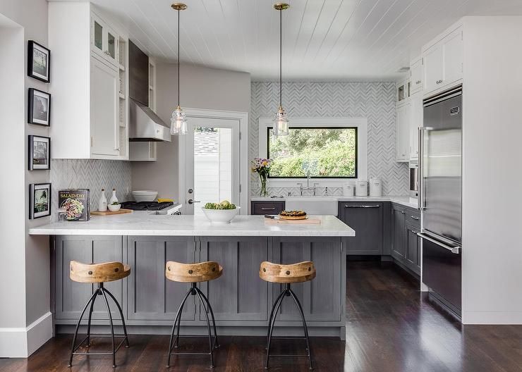 White and gray kitchen features gray distressed cabinets paired .