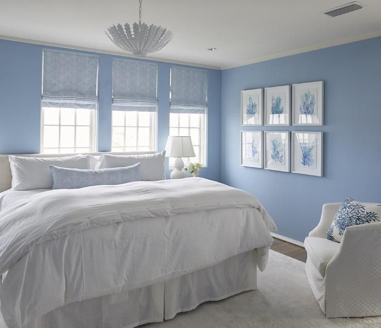 White and blue cottage bedroom boasts walls painted cornflower .