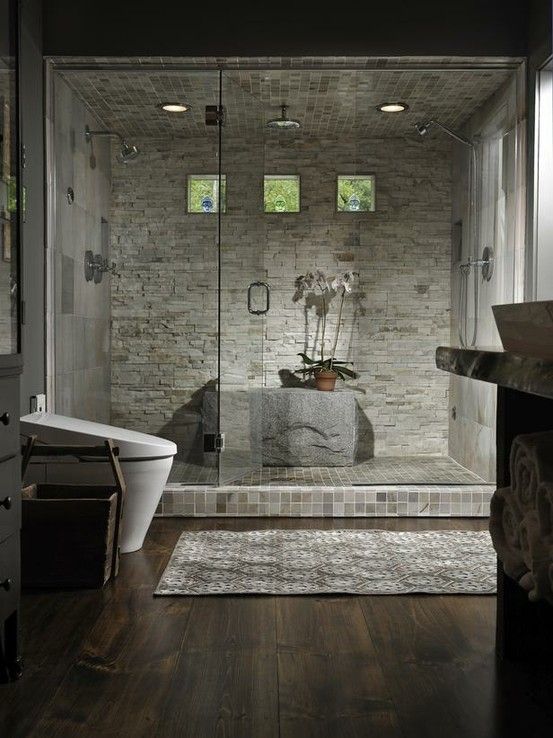 Luxurious Showers by lee. Two wall shower heads and one ceiling .