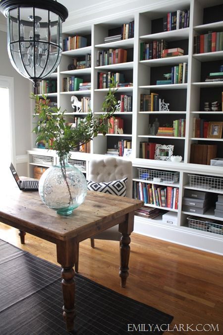 Love the huge wall-to-wall bookcases in this home office (With .