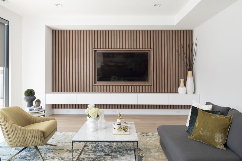 Design Detail – A Wood Slat Accent Wall Surrounds The TV In This .