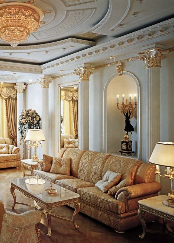formal living room. white and gold. columns. decorative capitals .
