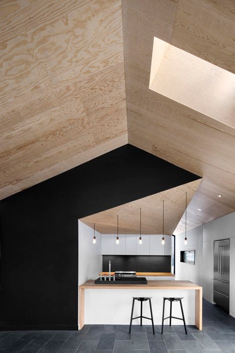 plywood ceiling / cathedral ceiling / black accent wall .