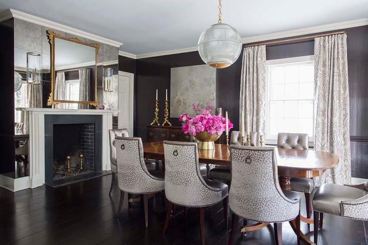 Dining Room with Antiqued Mirrored Fireplace Wall - Transitional .