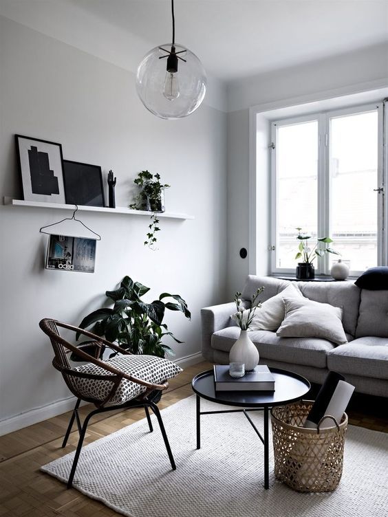 Minimalist monochrome corner living room with small wall shelf for .