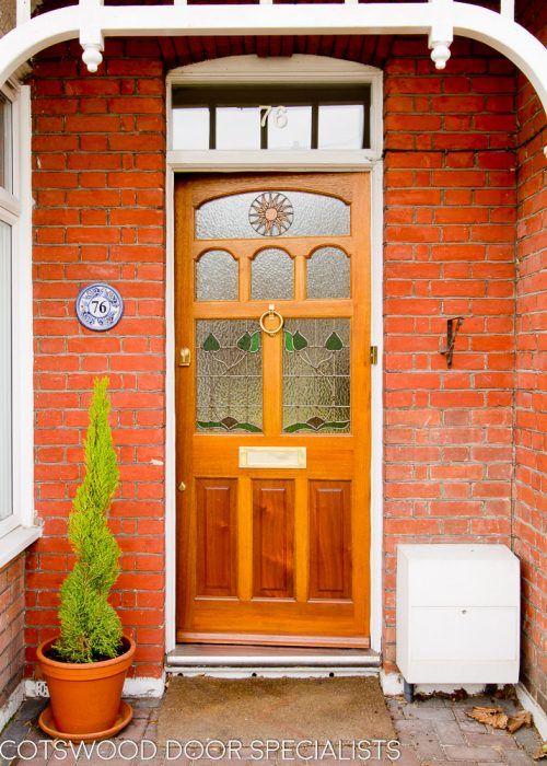 Stained timber Edwardian front door with classic stained glass .