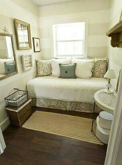 For a small (bedroom/den) space, turn your bed into a sitting area .