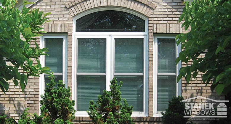 White double-hung windows with single prairie shadow V-groove and .