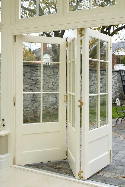 bi-fold doors...love this idea...would be cool to use across a .