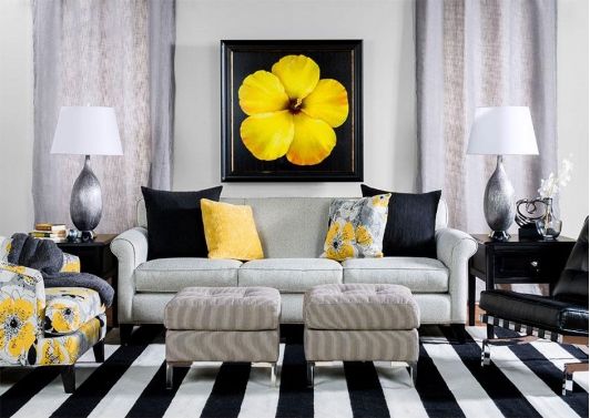 Contemporary living room with black, white and yellow accents .